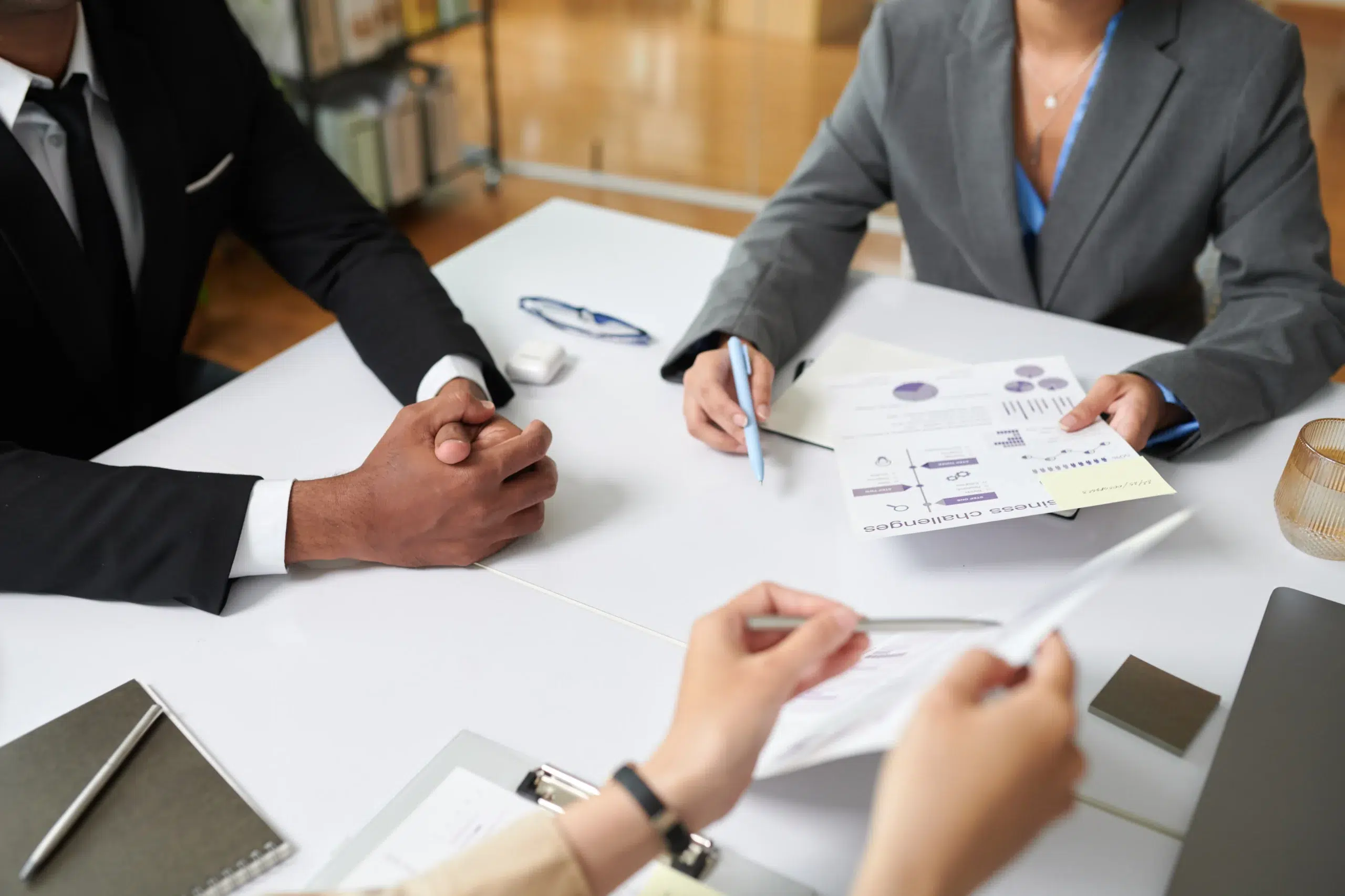 Business professionals analyzing medical billing reports before outsourcing claims processing